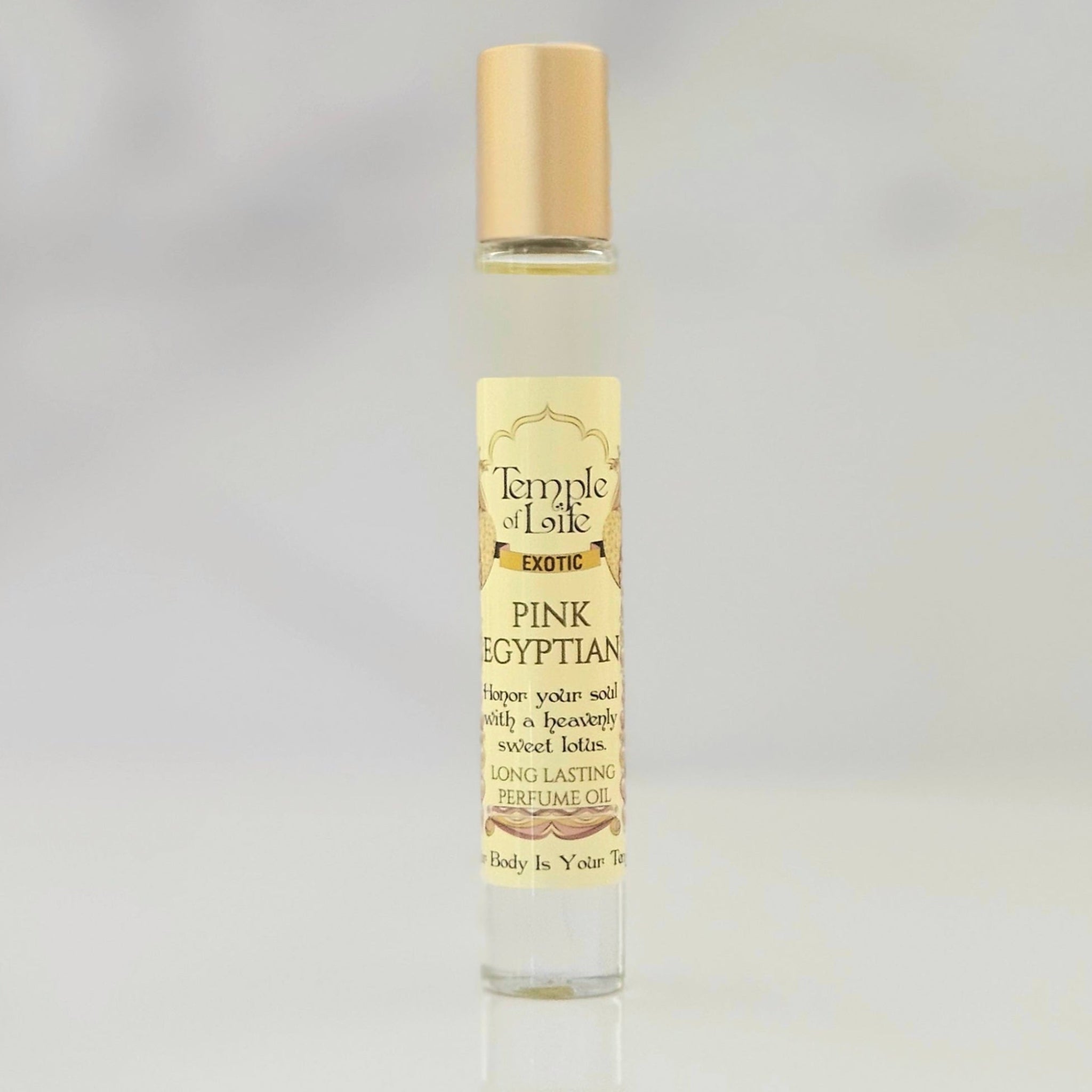 Perfume oil bottle labeled 'Pink Egyptian' by Temple of Life on a gray background