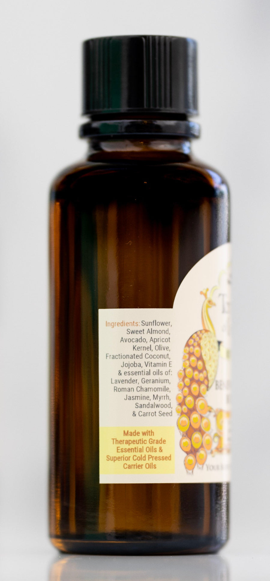 Amber apothecary bottles of soothing body oils labeled Benevolent Body with all-natural ingredients