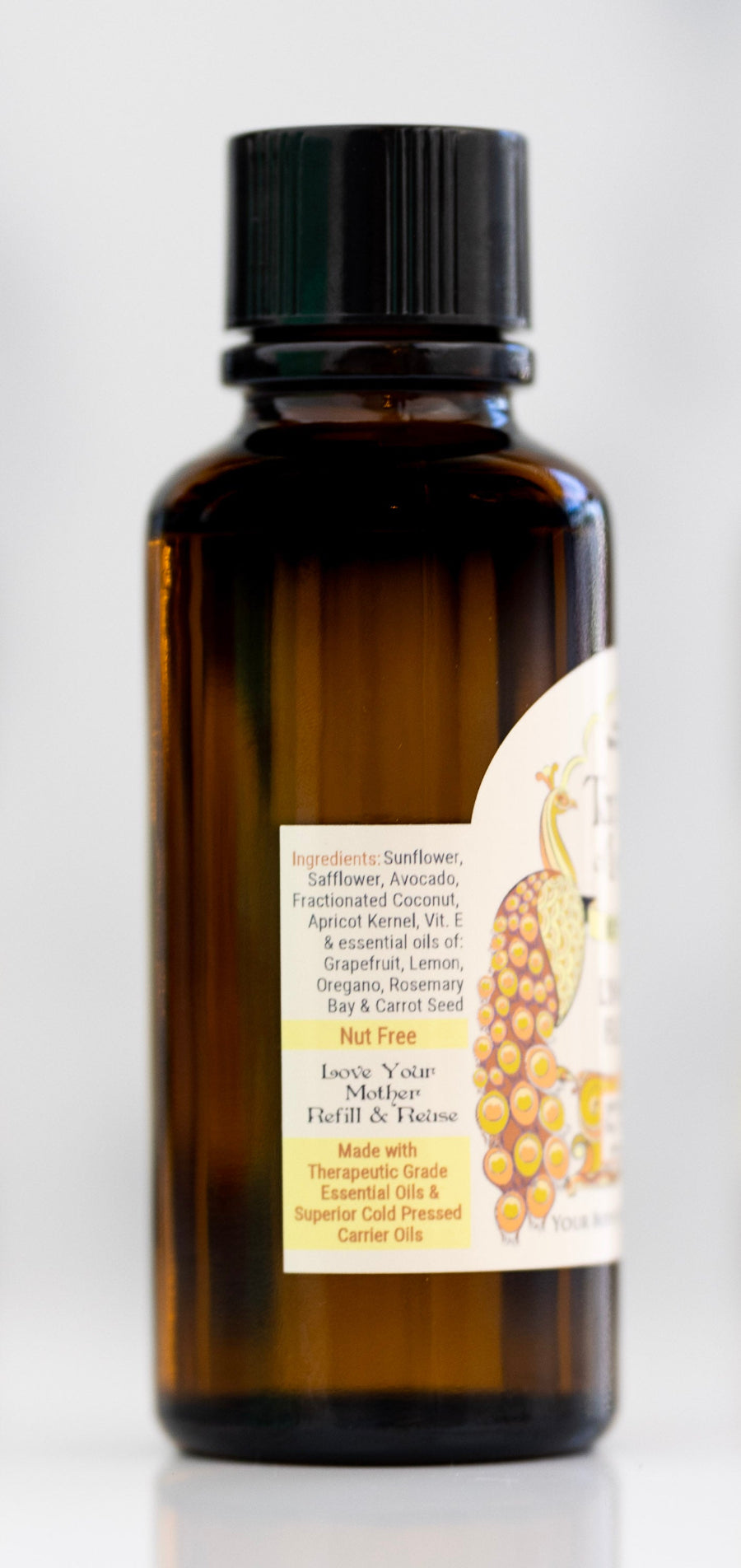 Bottle of Lymph Flow massage oil with ingredient label.