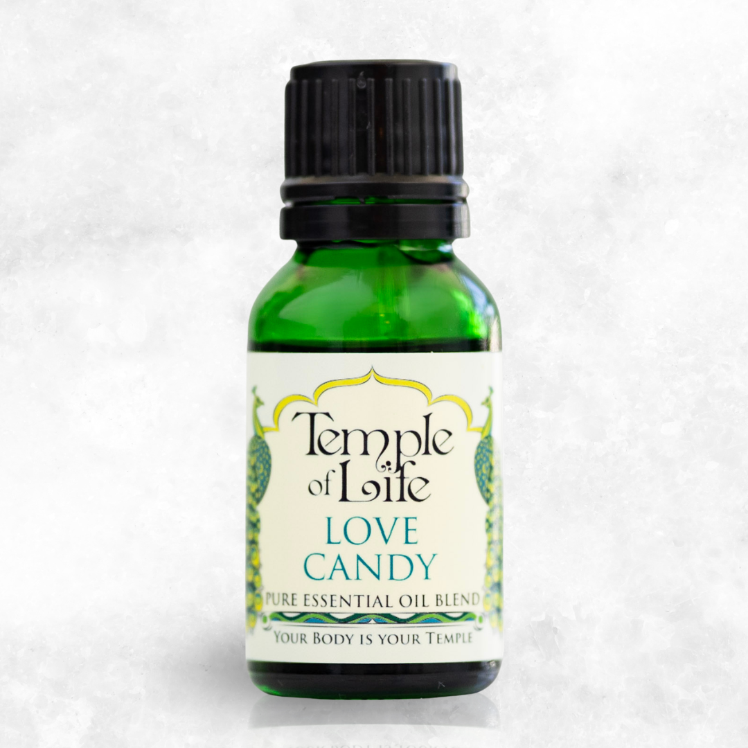 Bottle of Temple of Life Love Candy essential oil blend on a white background