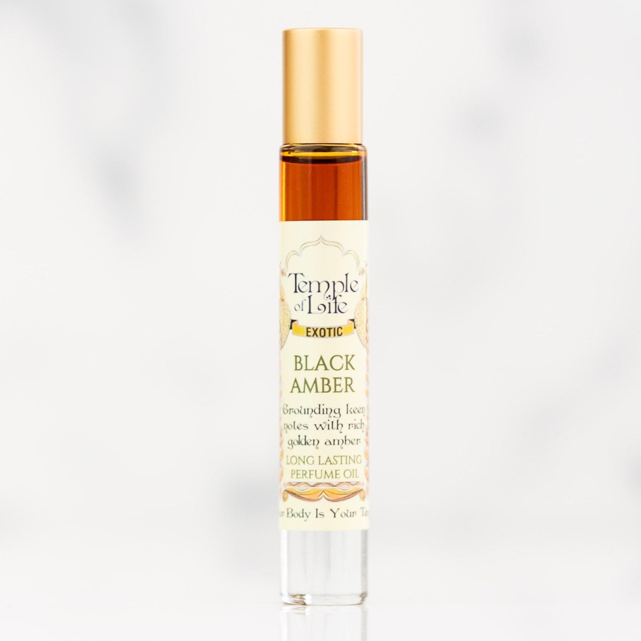Perfume bottle labeled 'Black Amber' by Temple of Life on a white background