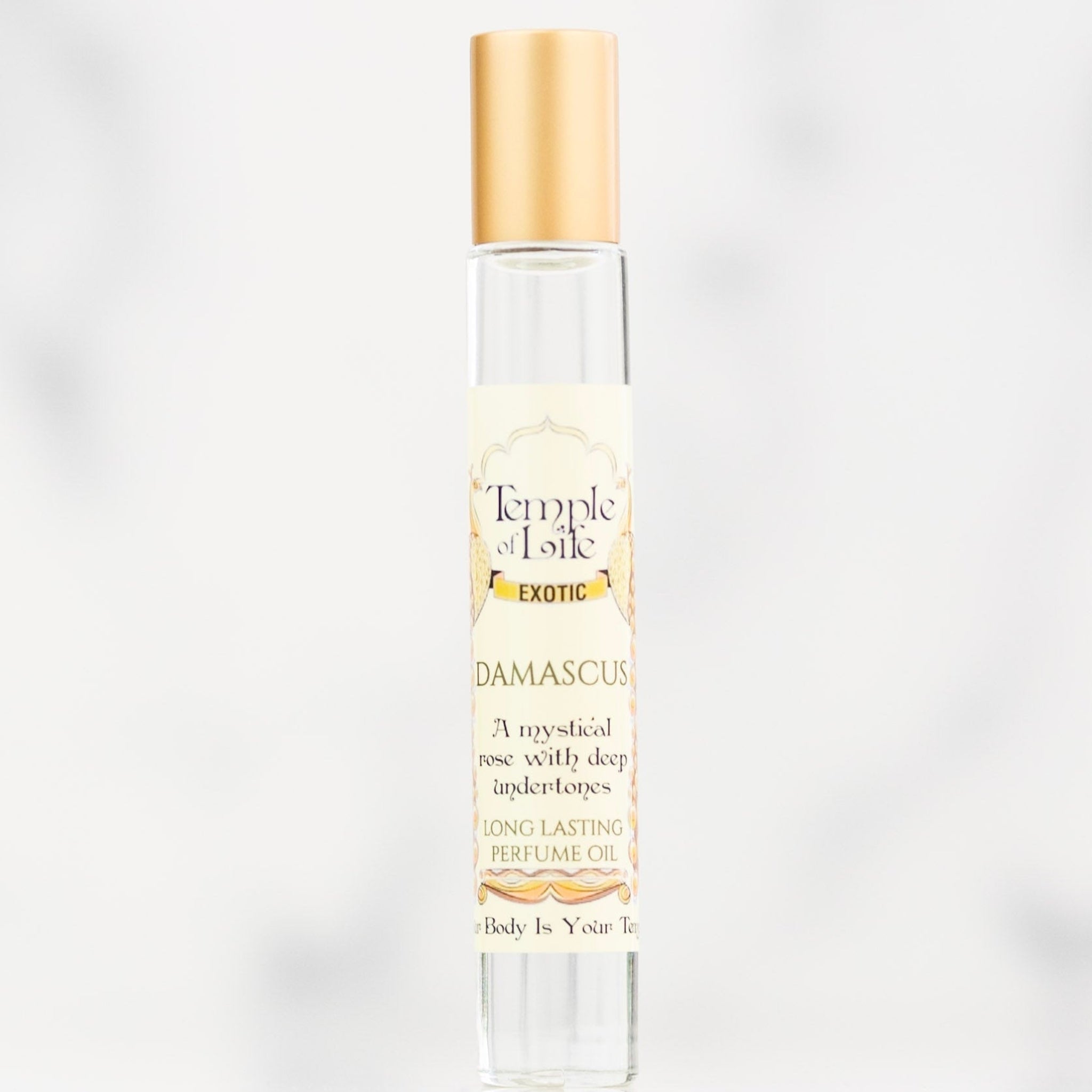 Rose oil perfume bottle labeled 'Temple of Life' on a white background
