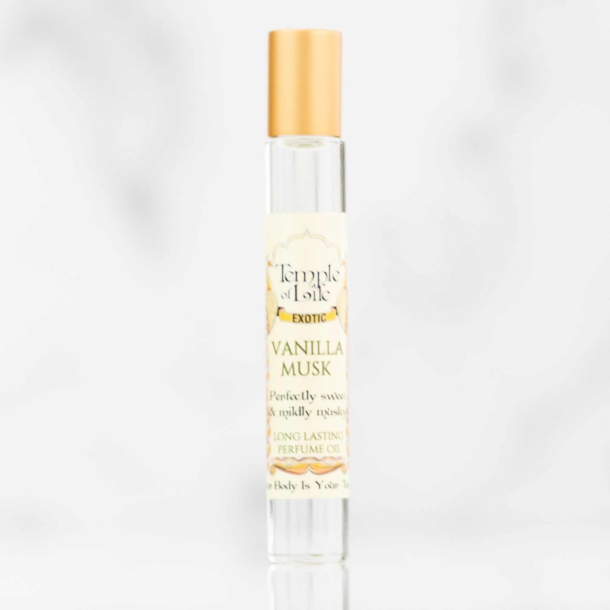 Vanilla Musk perfume bottle with gold cap on a white background