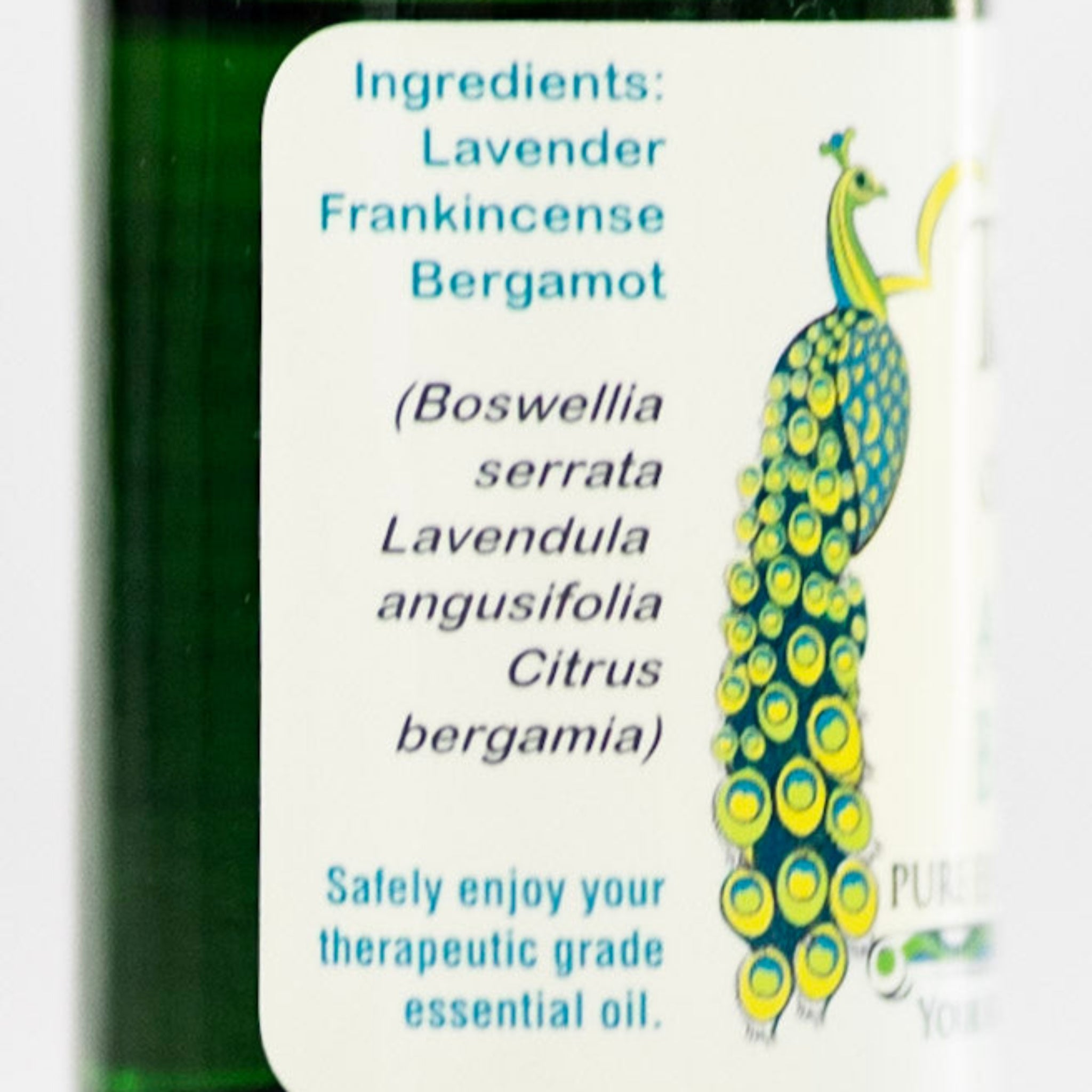 Bottle of essential oil with a label showing ingredients of Angels Breath frankincense oil blend.