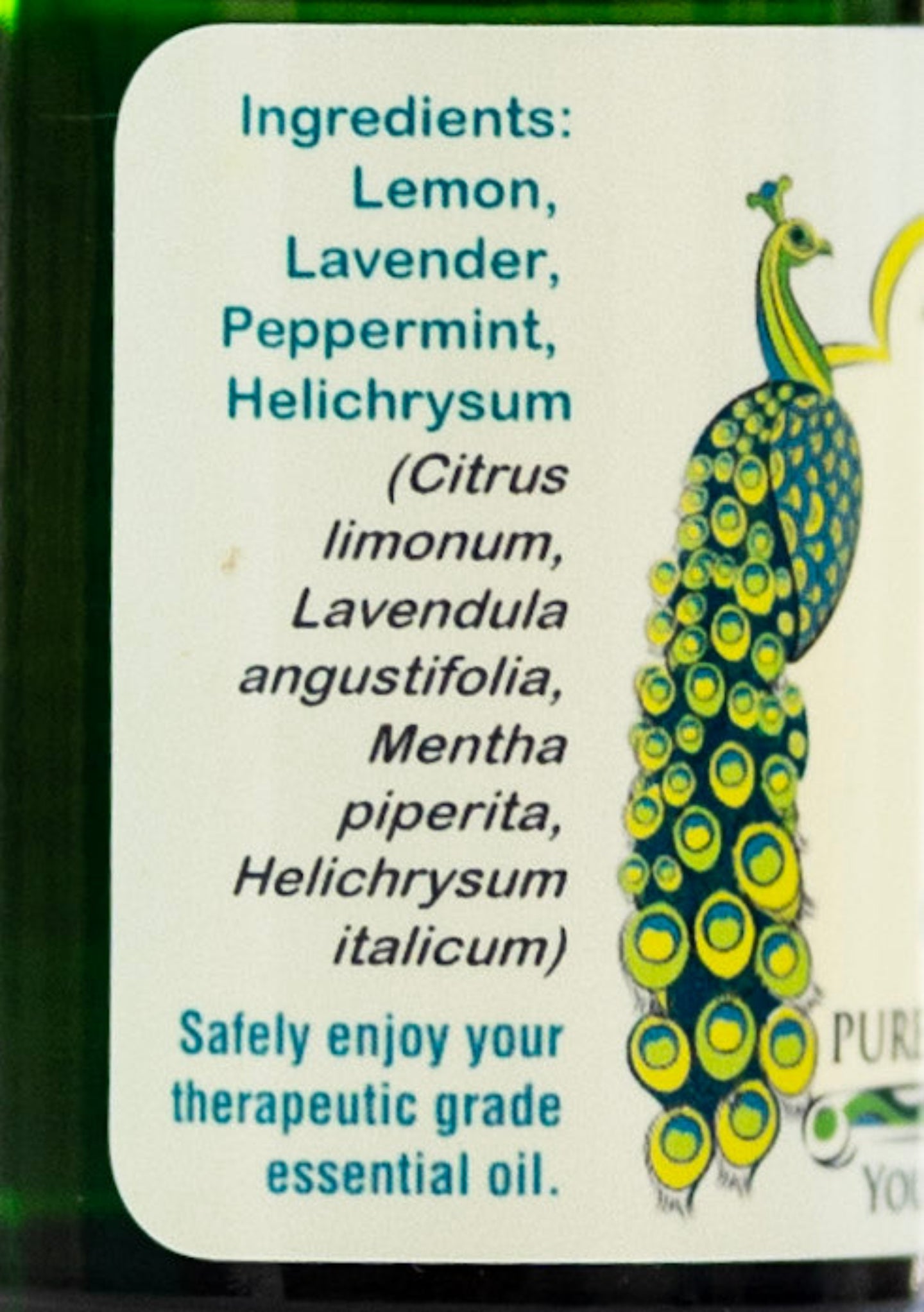 Label with ingredients list of an allergy blend and peacock illustration on a bottle of essential oil.